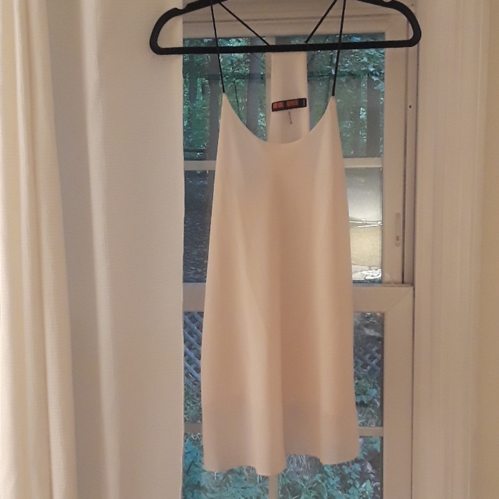 Pale pink tank top with black straps